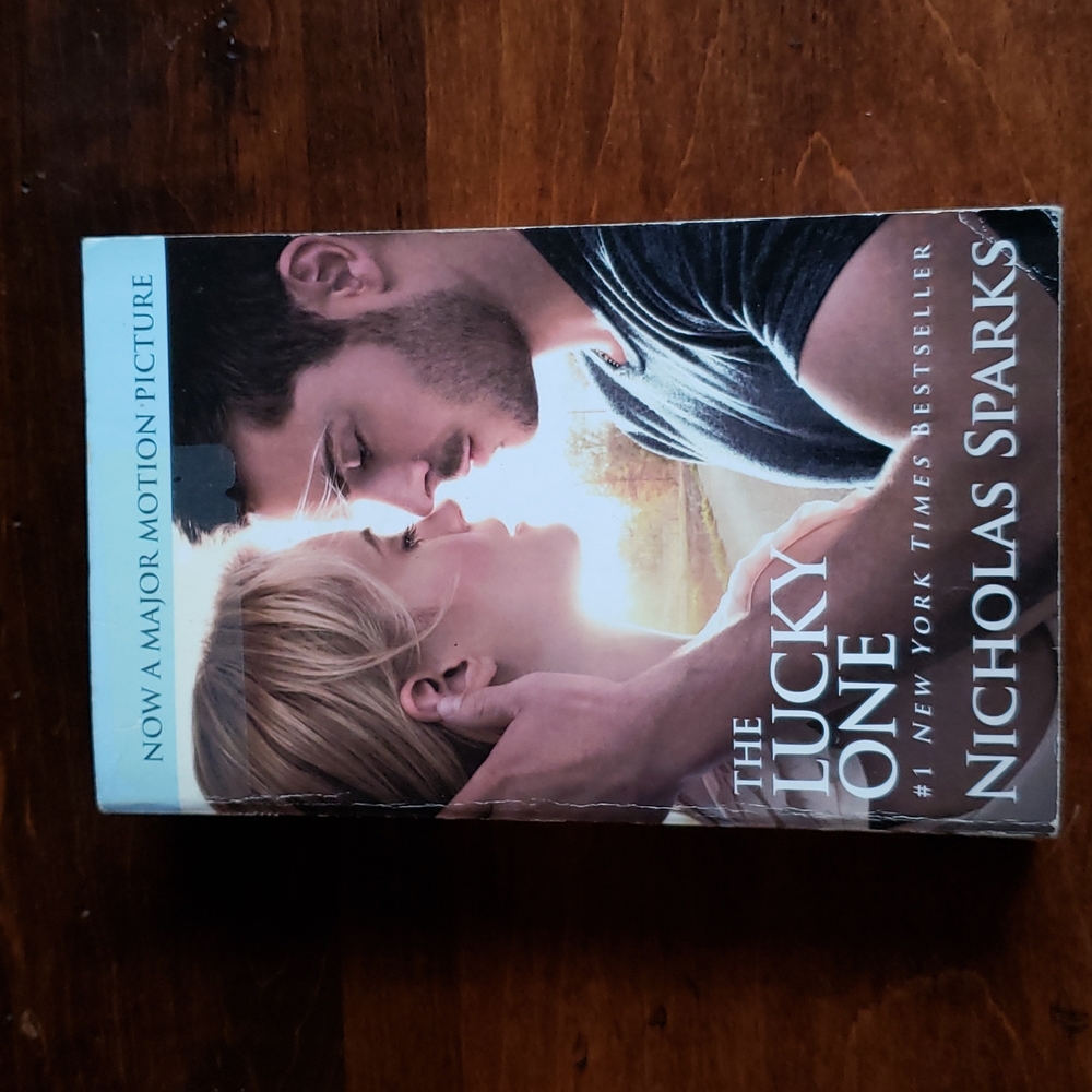 The Lucky One romance paperback by Nicholas Sparks (made into a movie)